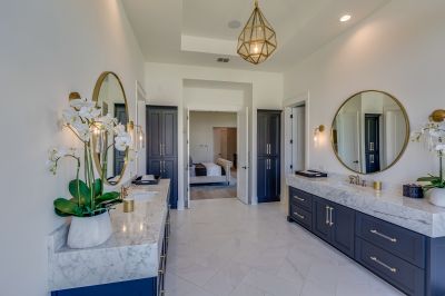 Marble countertops and backsplash in a renovated bathroom